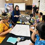 A group of people sitting around a table
AI-generated content may be incorrect.