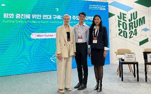 A group of people standing in front of a sign
AI-generated content may be incorrect.