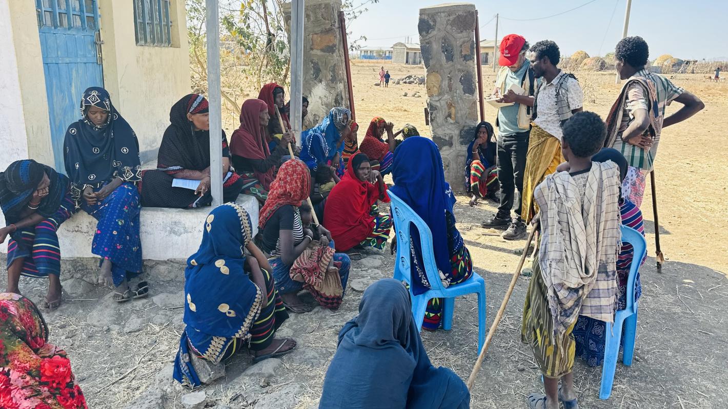 a group of villagers are gathering