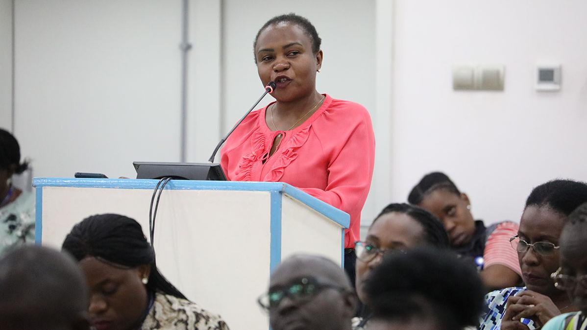 Deputy President NASA, Sharon Twongyeirwe, asks Director RSCE questions at the all-staff townhall