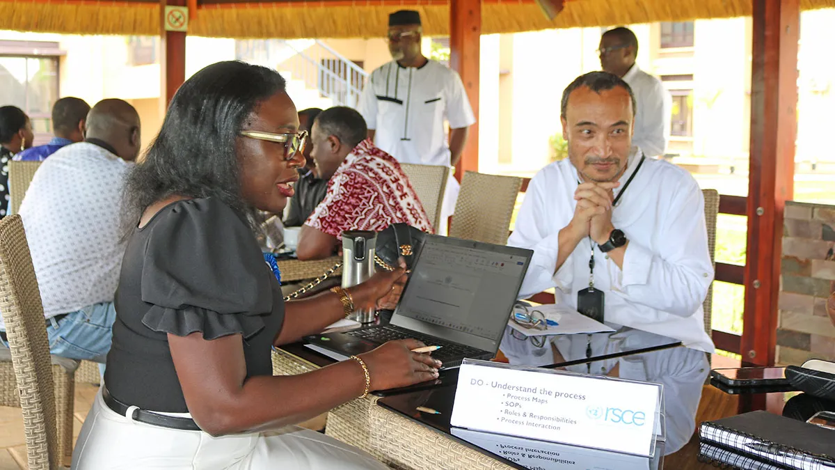 Chief LARRMU, Elise Metougue takes International Payroll and Benefits Service Line Manager, Manaswee Vaidya, through his checklist for ISO 9001:2015 documentation Chief LARRMU, Elise Metougue takes International Payroll and Benefits Service Line Manager, Manaswee Vaidya, through his checklist for ISO 9001:2015 documentation