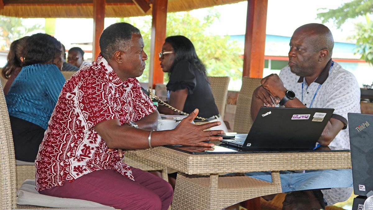 Chief of Regional IT Security Unit, Michael Mwaura (l) talks with ISO Consultant