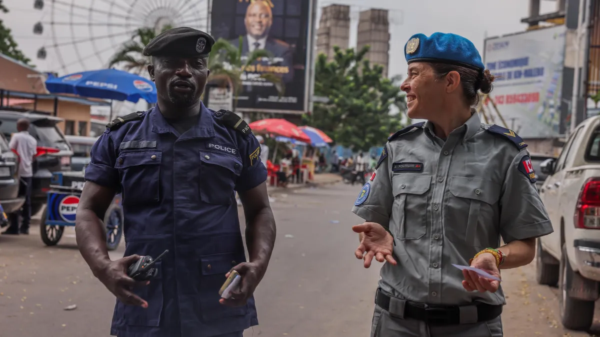 Two police officers engaging.