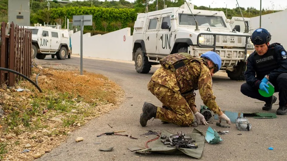 UN peacekeepers in Lebanon examine remnants of a drone