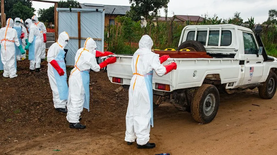 Members of a community team prepare to conduct burial of a person who died from Ebola in the eastern DR Congo
