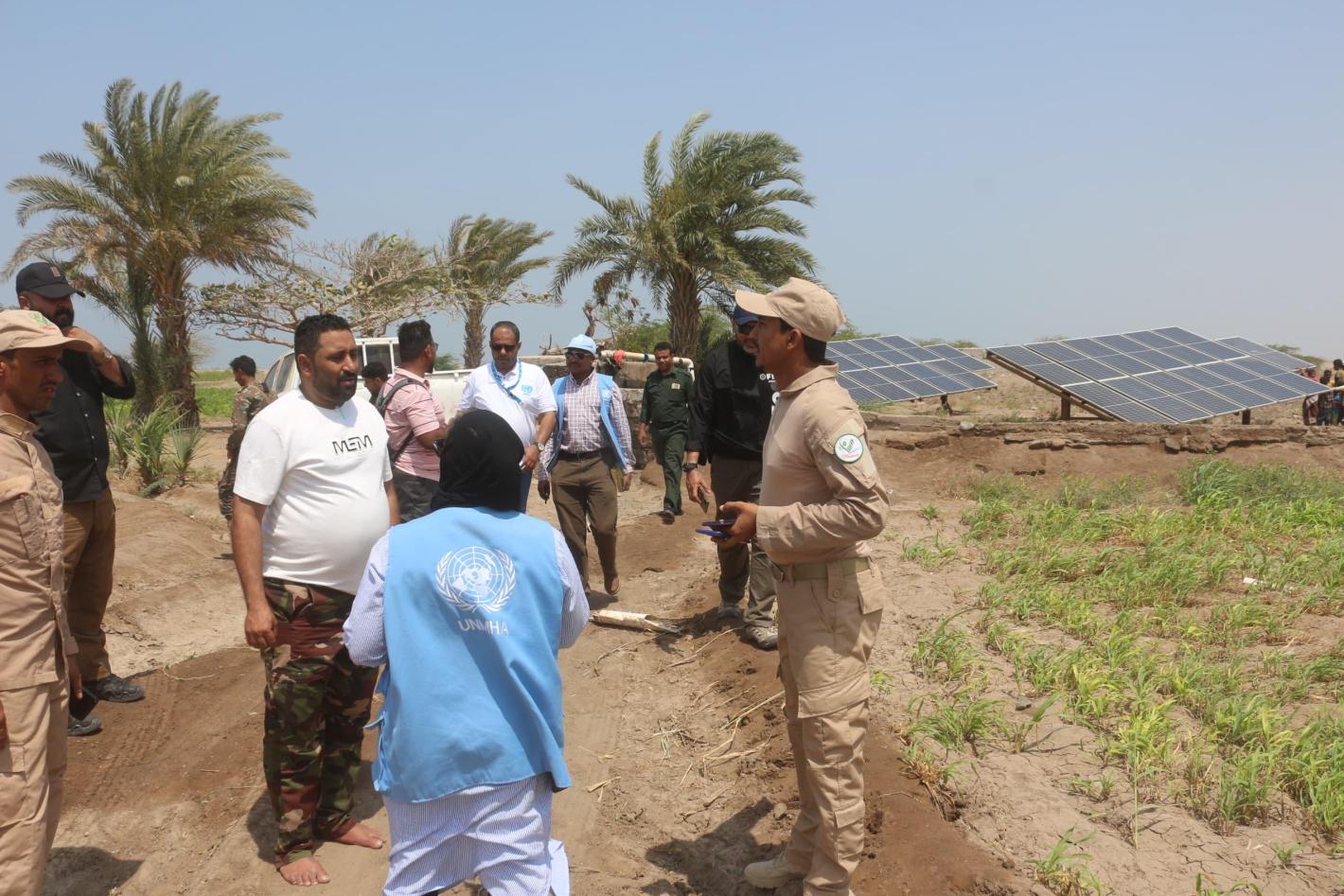 A group of people standing in the field