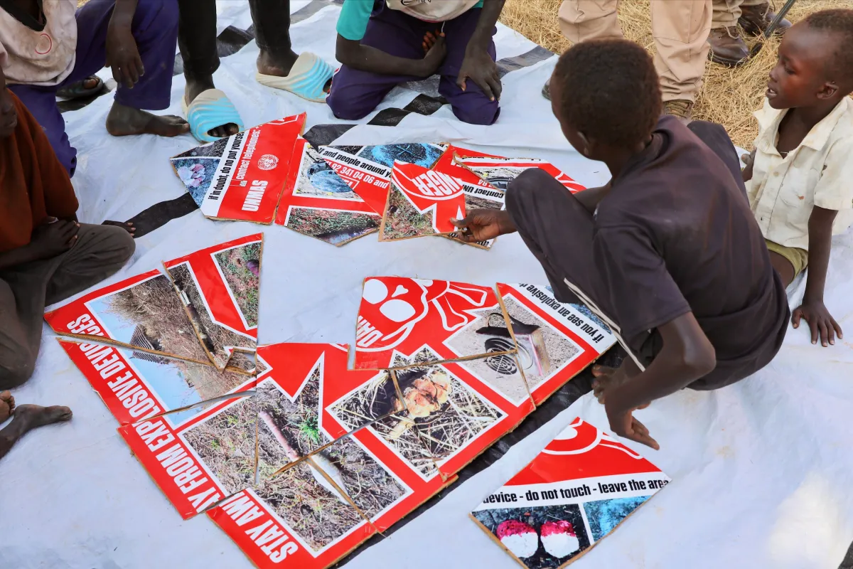 a child is piecing together a puzzle
