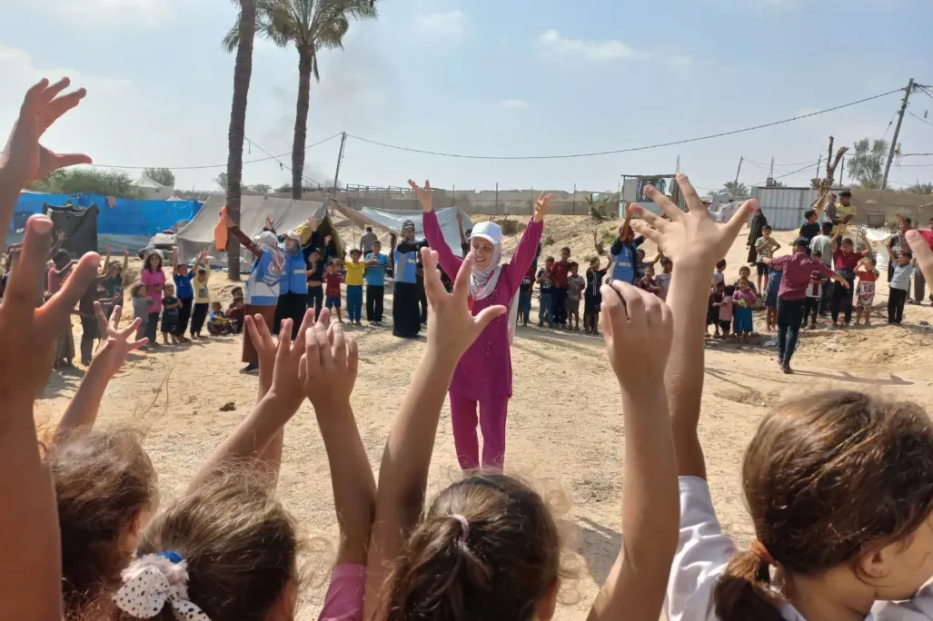 The Palestinian Organization for Development (POD) Risk Education Officer  providing an EORE session for children in Khan Younes - Al Mawasi, Middle Area, Gaza Strip, June 2024