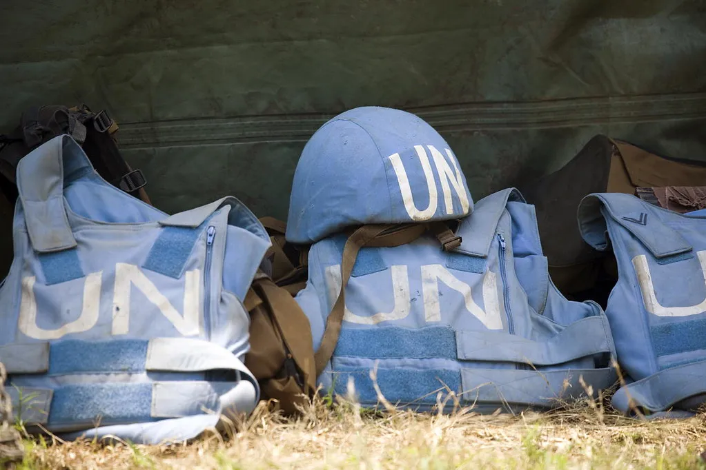 A blue helmet and empty protective gear.