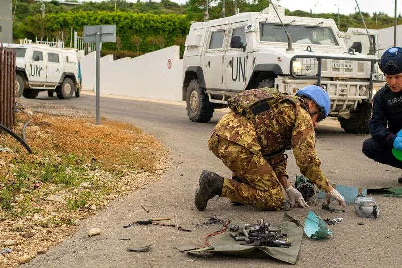 UN peacekeepers in Lebanon examine remnants of a drone