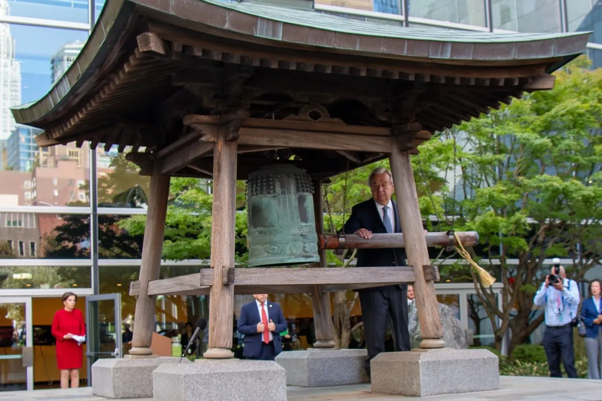 UN Secretary-General António Guterres rings the Peace Bell at United Nations Headquarters in New York