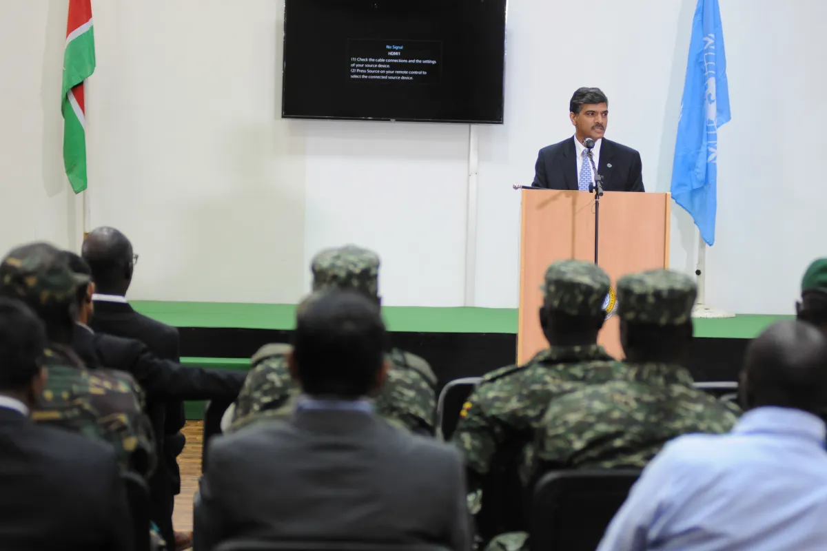 A man stands at a podium