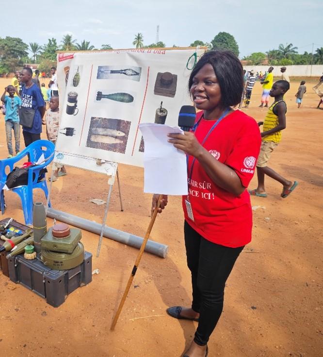 a woman is giving a presentation