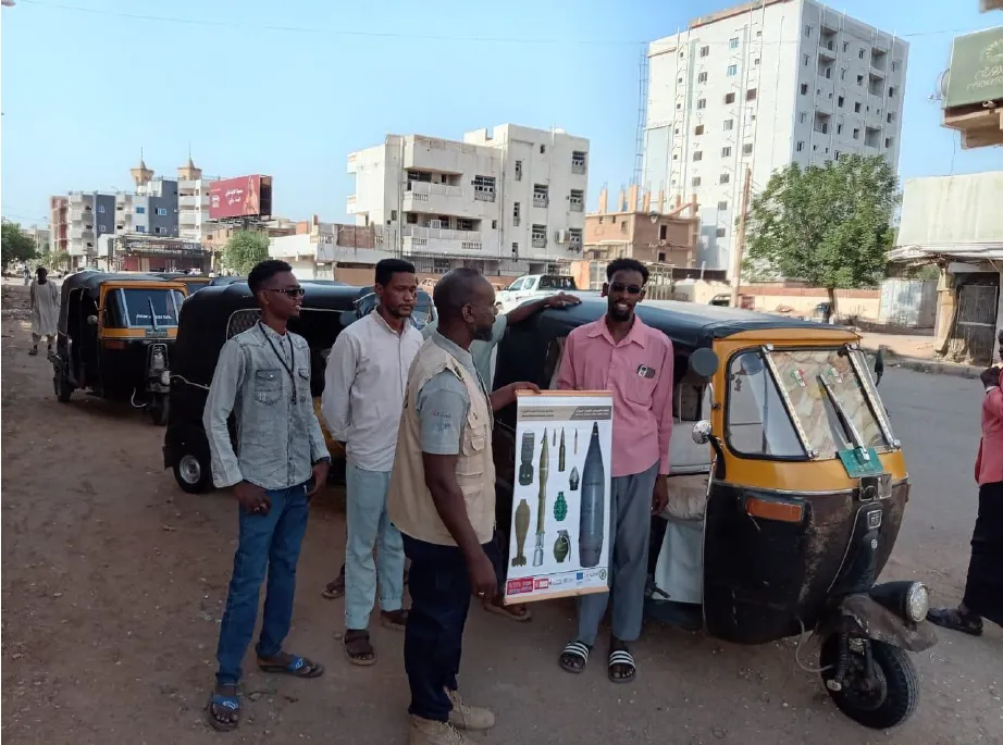 Community Liaison Officers conduct EORE outreach to local residents and drivers in Khartoum  (Photo - UNMAS/SLG)