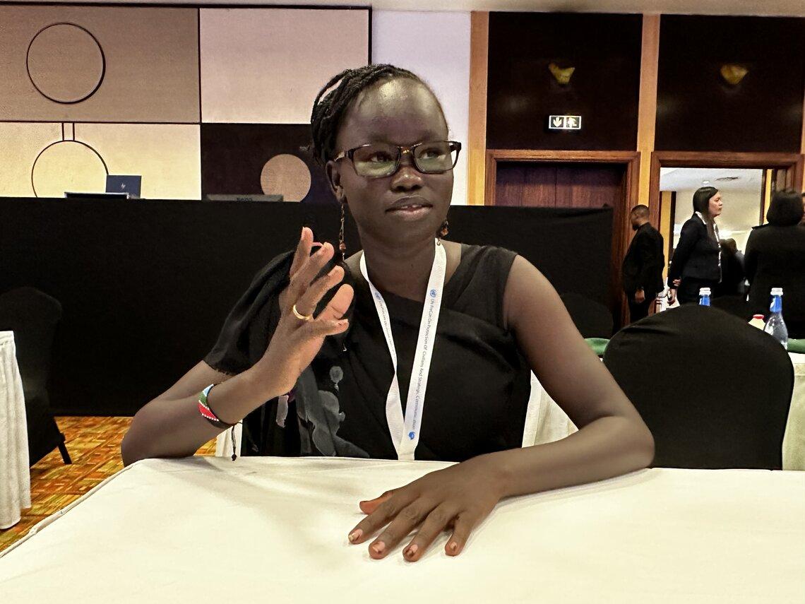 Conference participant Bakhita Steven speaks of her own experience fleeing violence in her home country South Sudan on the sidelines of UN Peacekeeping Ministerial preparatory conference in Kigali, Rwanda on 24 October 2023. UN Photo/ Francesca Mold