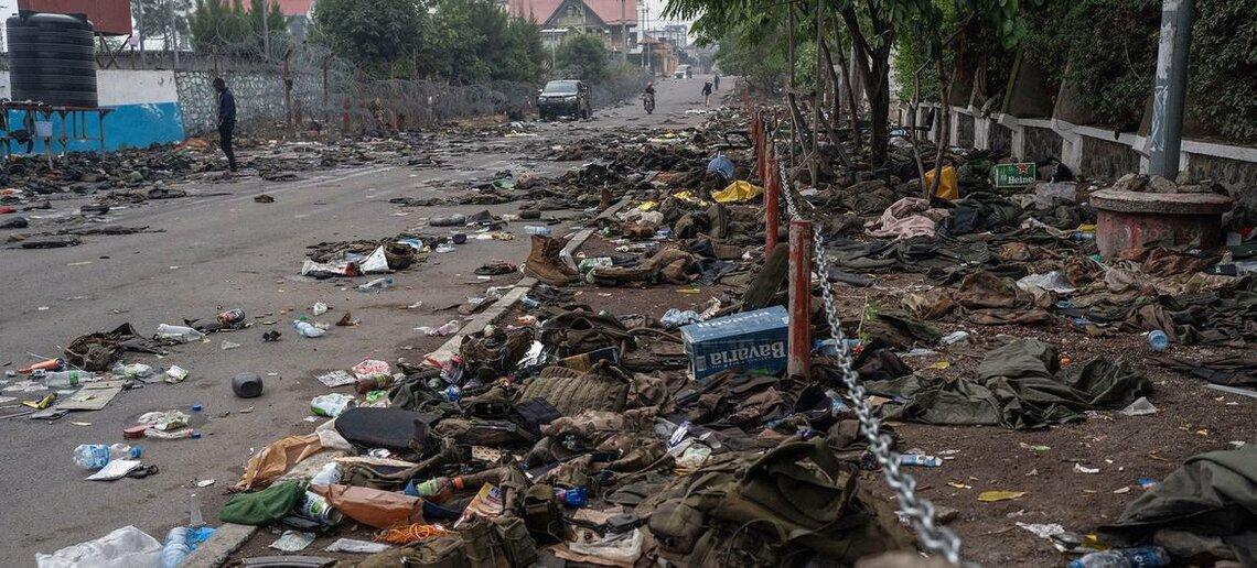 Military uniforms and personal possessions litter the streets of Goma in the eastern DR Congo following an attack by a rebel armed group.